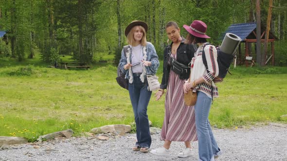 Female Friends Having Walk Around Campsite alt