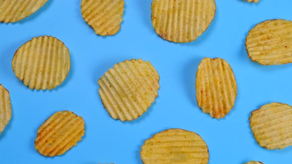 Rotating Blue Background with Corrugated Ruffled Potato Chips