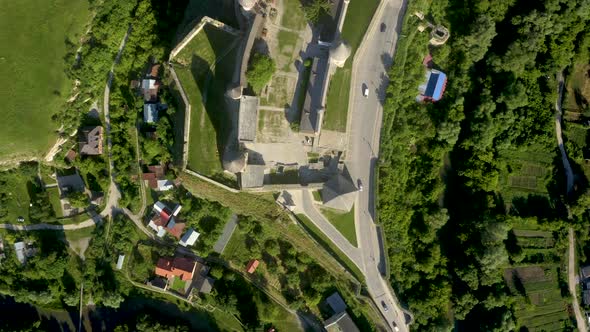 Aerial View of the Ruins of a Large Medieval Castle in Europe alt