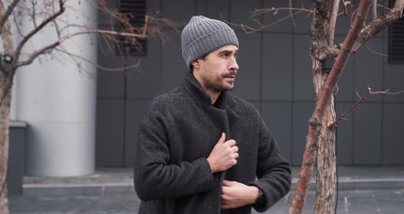 Man Waits Partner for Business Meeting Who is Late Outside It's Cold