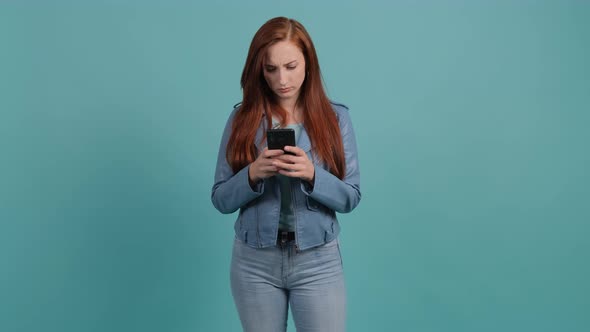 Portrait of a Upset Confused Woman Looking at Mobile Phone. alt