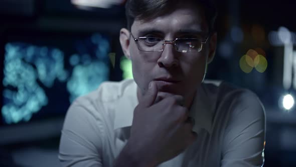 Thoughtful IT Programmer Looking at Camera alt