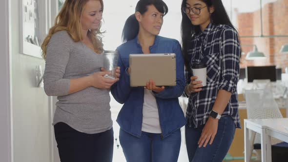 Businesswoman discussing on digital tablet 4k alt
