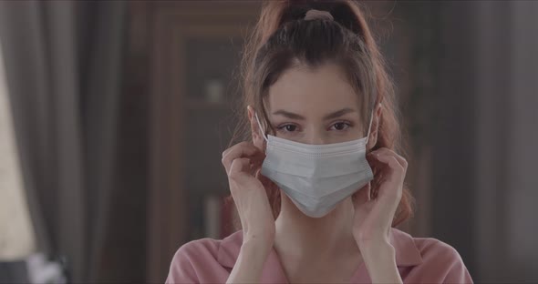 Happy Woman Takes Off The Surgical Mask From Her Face And Throws It Away