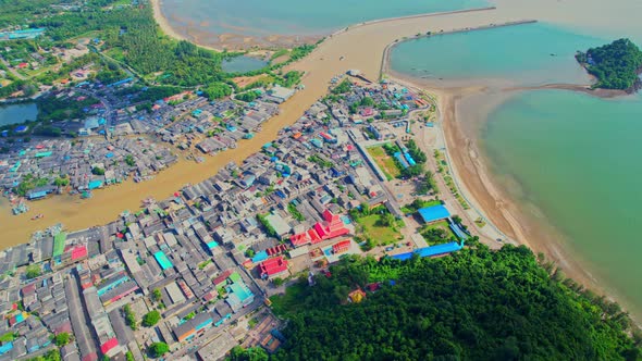 Aerial Shot of Local Fisherman Village Beside the sea alt