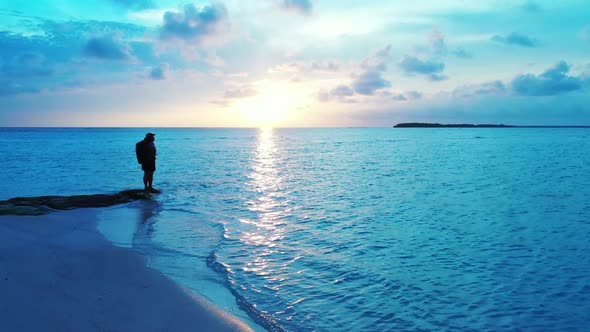 Tourist posing on perfect shore beach wildlife by blue ocean and white sandy background of the Maldi alt