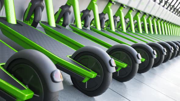 Countless green electric scooters charging using photovoltaic energy charger. 4K alt