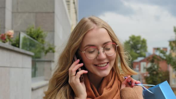 Closeup Happy Girl Walking on Street Attractive Young Woman Enjoys Mobile Phone Conversation alt