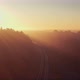 Railway road in the foggy forest at sunrise. Aerial view. - VideoHive Item for Sale