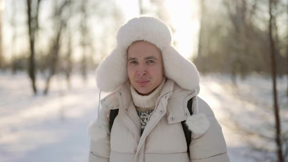 A Handsome Man Looks Into the Camera alt