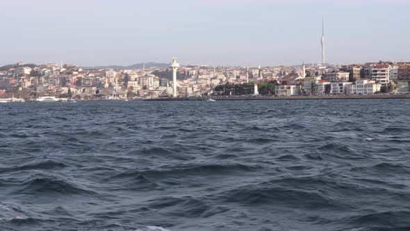 View From A Boat Sailing At Bosphorus With City Buildings And Towers At Uskudar, Istanbul, Turkey. - alt