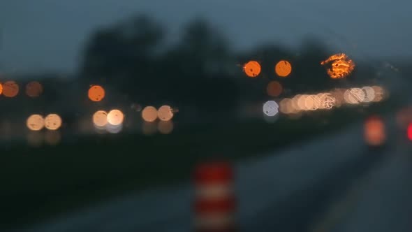 Hard Rain Fall at Night with Blurry Cars Selective Focus alt