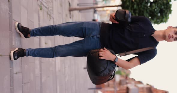 Rear View Man Walking in City with Black Leather Backpack alt