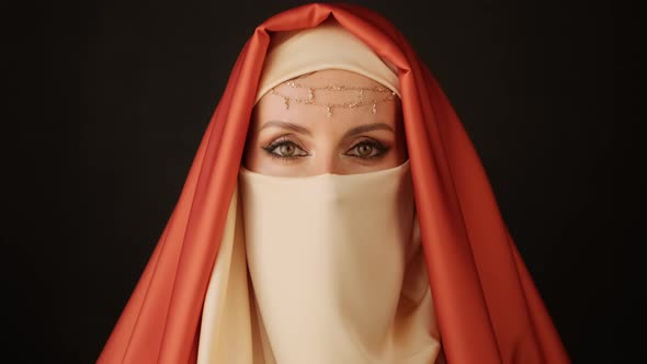 Close Up Portrait Of Beauty Young Muslim Woman In Hijab Looking At Camera.