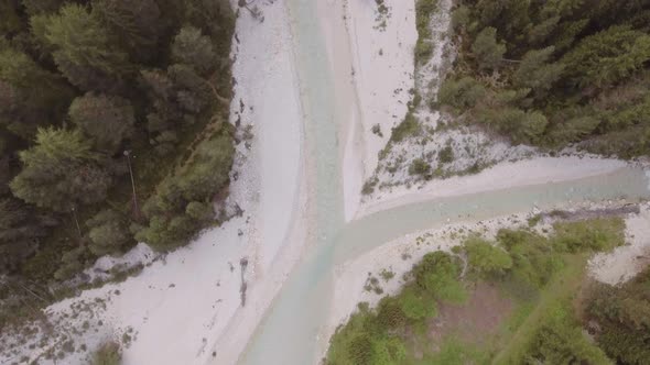 Overhead Aerial Flight Above River Creek with Woods and Rocks