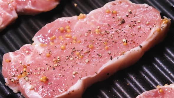Raw Meat is Fried on an Electric Grill Close Up