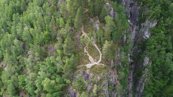 Top-down view of Dangerous Via-Ferrata mountain climbing enroute to mountain Hoven - Trail on cliff alt