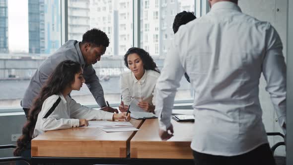 Young Male Leader Open Office Doors Distributes Responsibilities Employees Multiracial Working Group alt