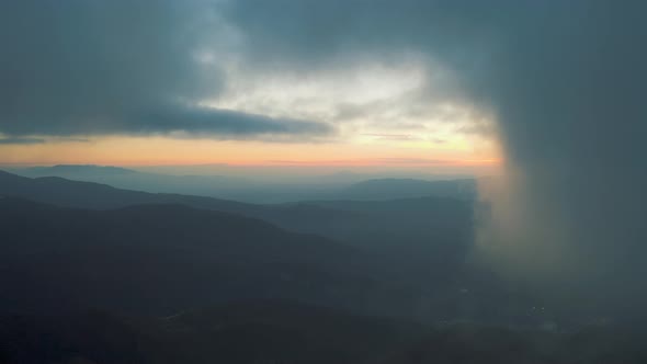 Flying through the clouds at sunset