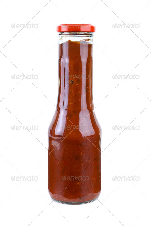 Bottle with piquant tomato ketchup - Stock Photo - Images