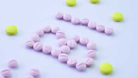 The Word FBI Is Laid Out From Drugs on a White Table and Revolve Close-up alt