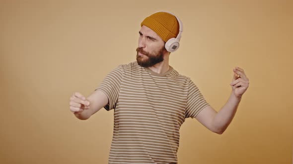 Brutal Hipster Enjoys Listening to Music in Headphones alt