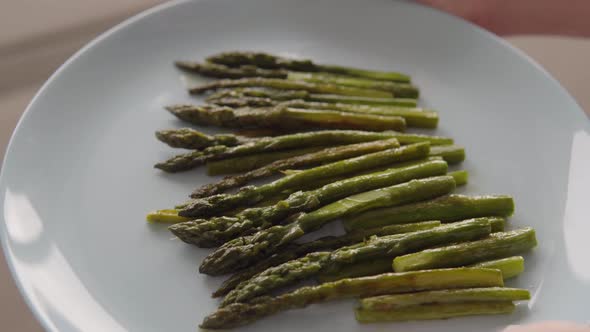 Close Up Shot of Roasted Green Asparagus on a Plate