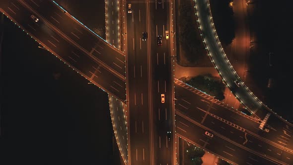 Aerial Top View of Highway Interchange at Night alt