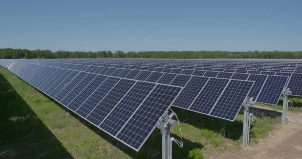 shots of solar panels on a solar farm alt