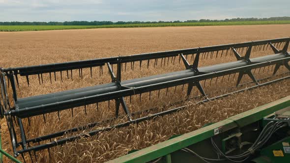 Combine Harvester in the Wheat Field, Close-up alt