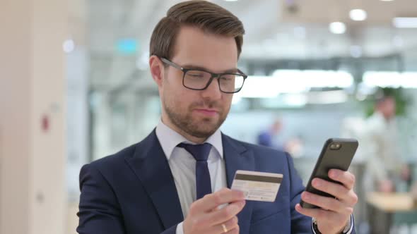 Online Payment Success on Smartphone By Businessman alt