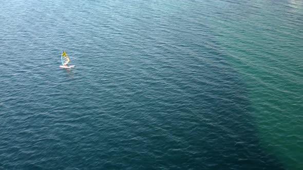 Aerial Drone View of a Man at Windsurfing in Aegean Sea alt