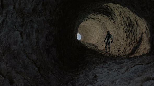Reptilian Humanoid Exploring A Cave alt