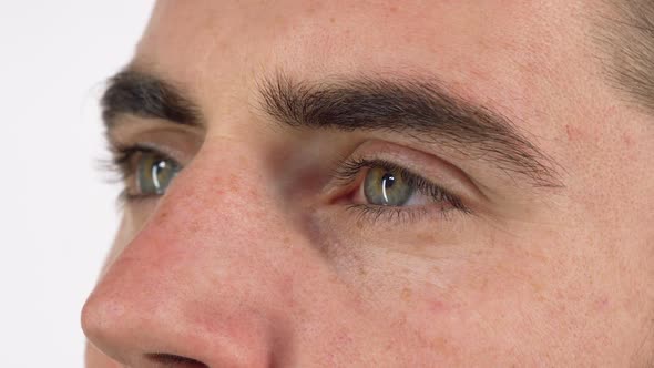 Green Eyes of a Man Looking Away Dreamily and Smiling 1080p alt