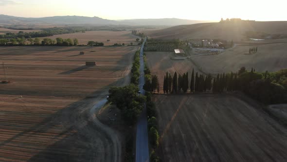 Aerial view of a road during sunset in Tuscany, Italy, Europe alt