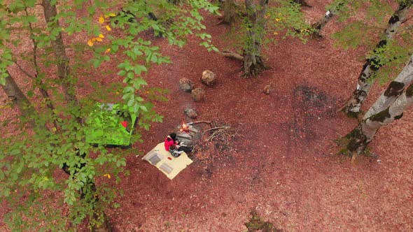 Rising Aerial View Of Single Mother With Child Camping Outdoors In Autumn alt