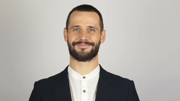 Young Successful Businessman Looking at the Camera and Smiling alt