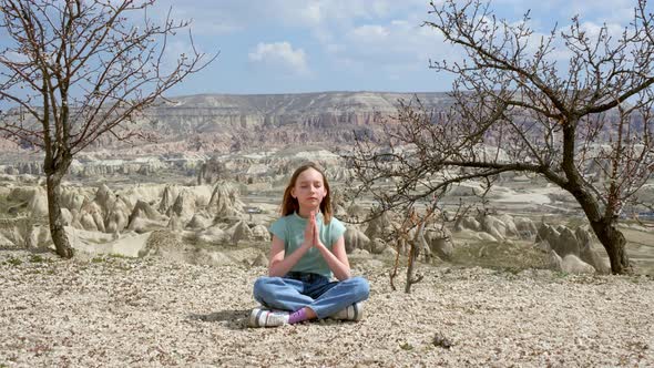 Young Woman Practising Outdoor Lotus Pose in Highlands Valley alt