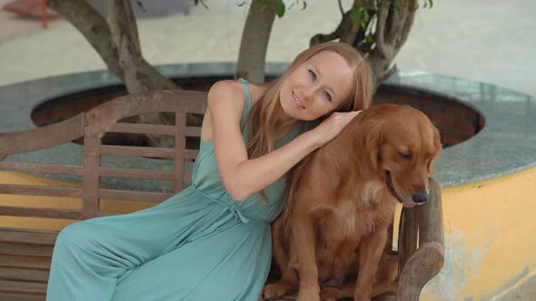 Young Woman Visits a Dog Farm, Where You Can Hang Out with Lots of Cute and Adorable Dogs alt