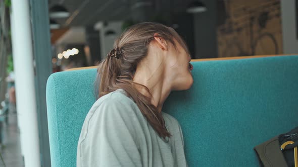 Young Mixed Race Woman Sitting and Laughing About Funny Joke alt