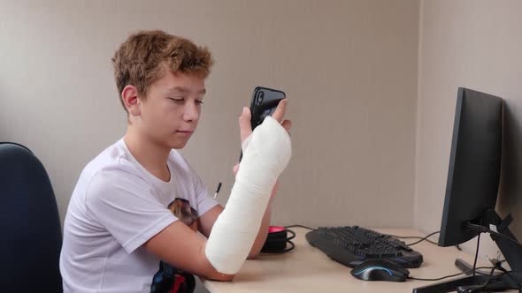 Teenager in Cast Uses Phone
