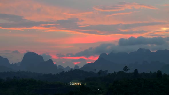 Sunset View of Mountains in Khao Sok National Park, Thailand. Panning Shot alt