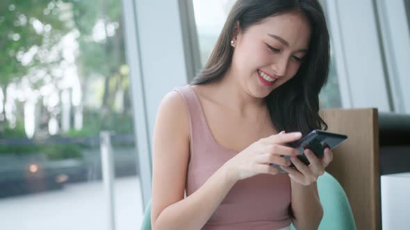 attractive smart casual female hand typing chat with smartphone tele communicatio alt