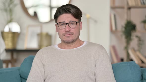 Upset Middle Aged Man Feeling Sad at Home alt