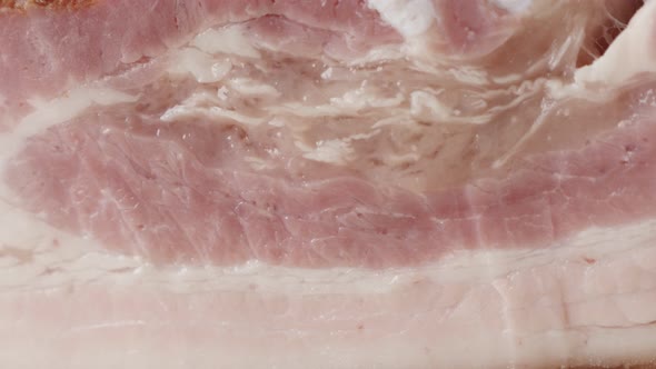 Texture of cured bacon traditional  food background  4K 2160p 30fps UltraHD  panning footage - Layer alt