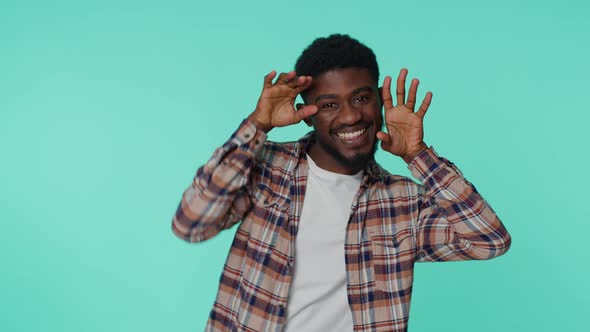 Funny Joyful Man Making Playful Silly Facial Expressions Grimacing Fooling Around Showing Tongue alt