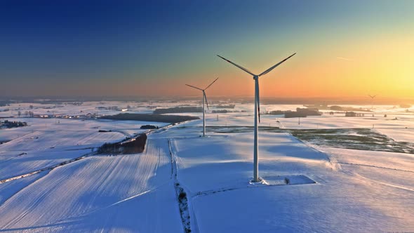 Wind turbine on snowy field in winter. Alternative energy, Poland alt