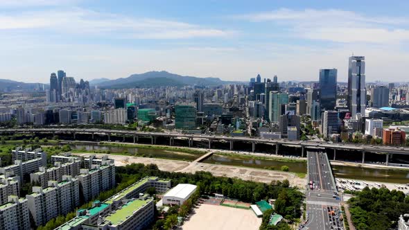 Seoul Downtown City Skyline with River and Mountain on the Background. alt