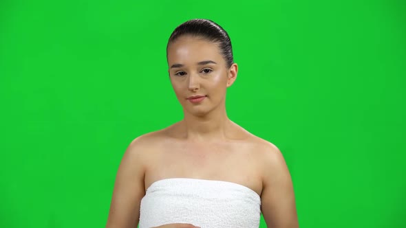 Cute Girl in a White Towel Was Suddenly Frightened Then Sighed in Relief on Green Screen at Studio alt