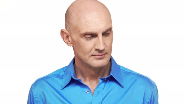 Bold Caucasian Middleaged Male Standing on White Background and Screaming alt